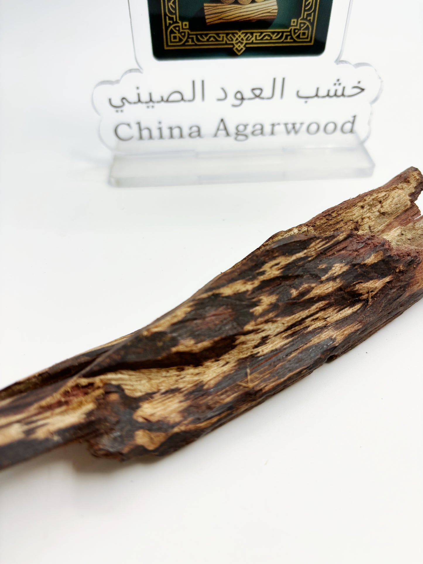 Close-up of premium big-leaf Hainan sandalwood showing robust natural oil veins