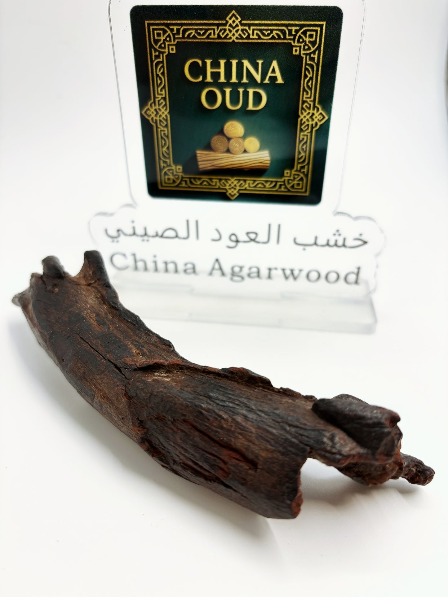 Close-up of premium Hainan sandalwood showing its rich waxy oil texture